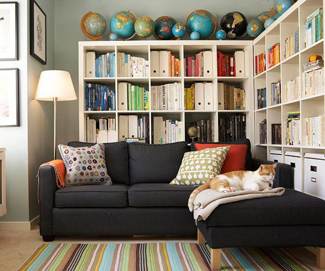 family room bookshelves with globes